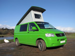 SX12376 Our green VW T5 campervan with popup roof up at Ogmore Castle.jpg